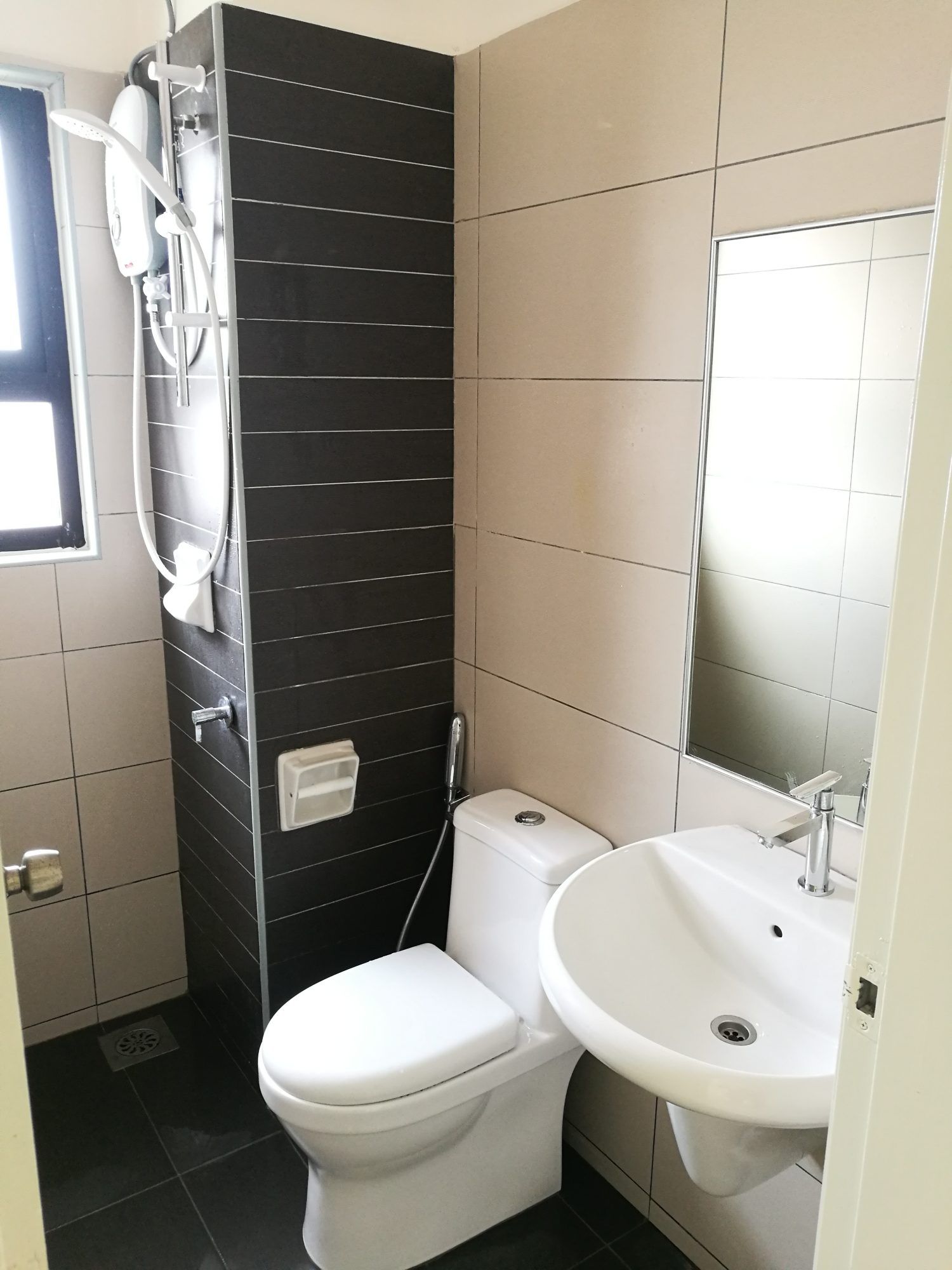 Fitted water heaters and updated bathroom fixtures across both units.